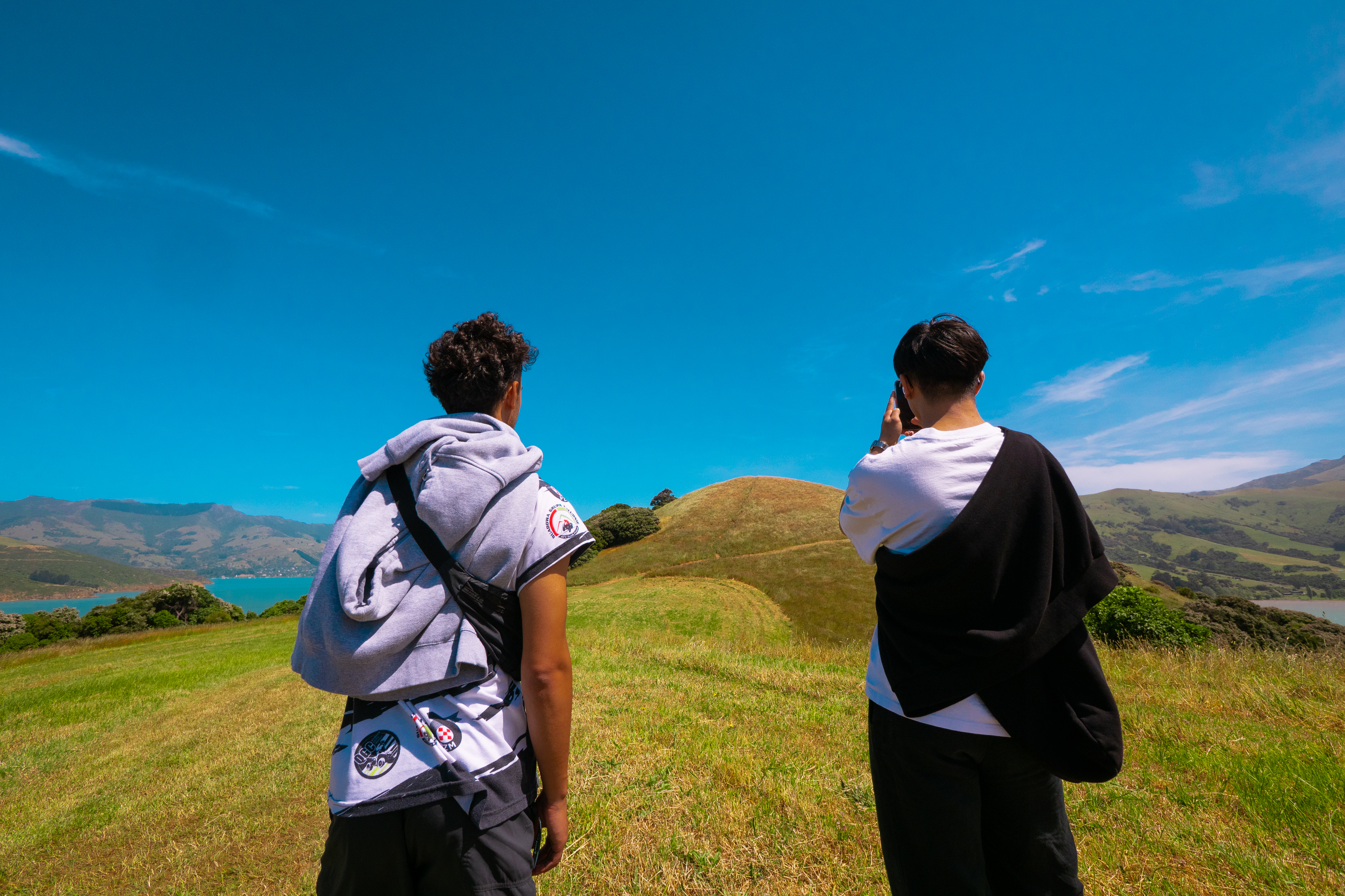 Michael and a friend overlooking New Zealand landscape