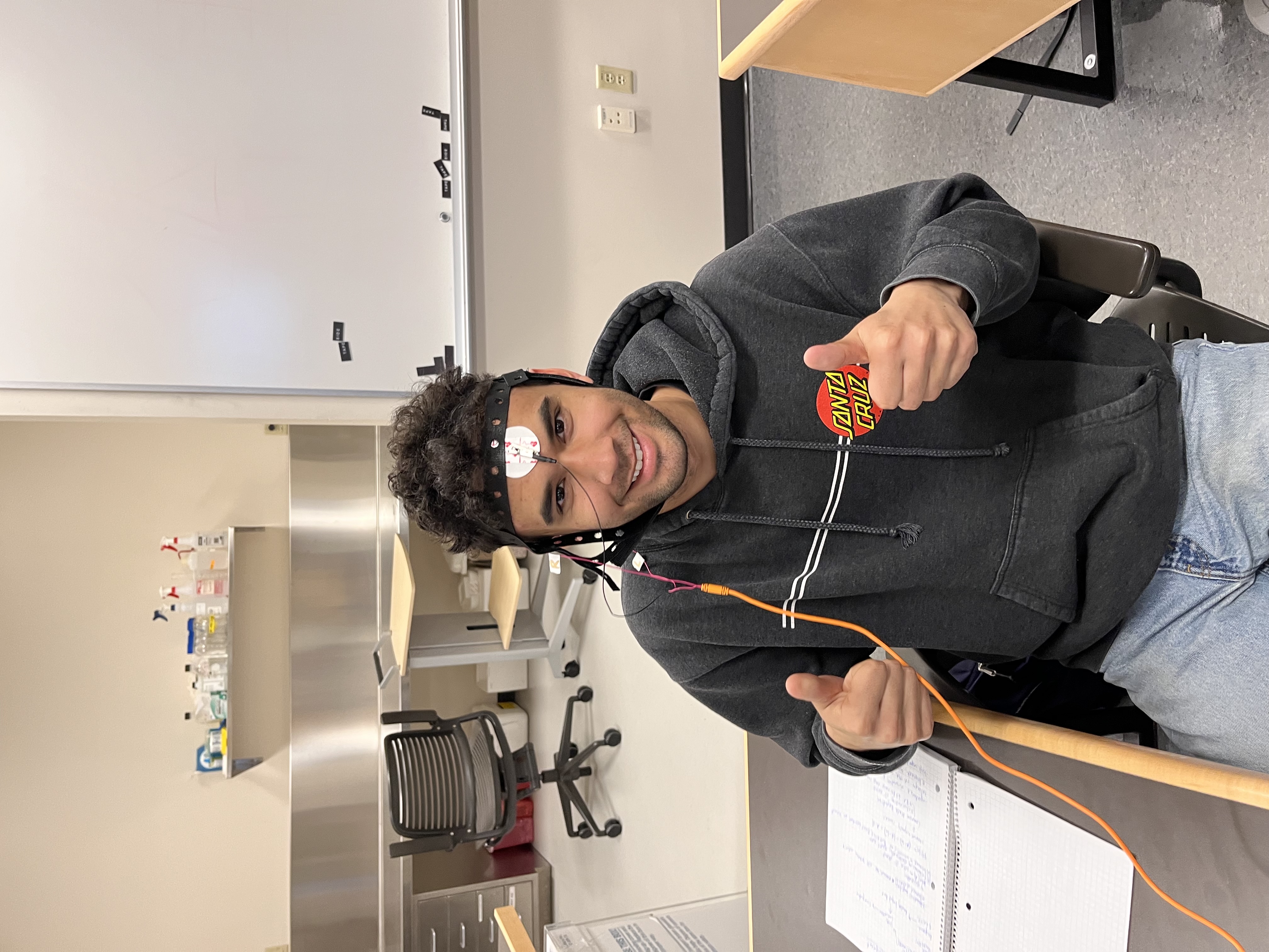 Michael in the neuroscience lab with EEG sensors